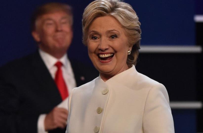 Trump and Clinton (photo credit: PAUL J. RICHARDS/AFP)