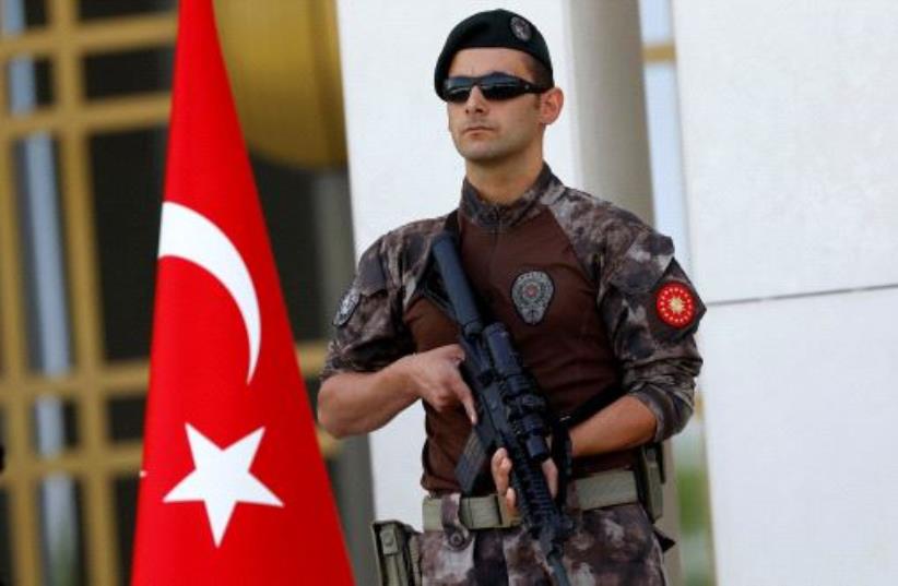 A Turkish special forces police officer guards the entrance of the Presidential Palace in Ankara, Turkey, August 5, 2016 (photo credit: REUTERS)