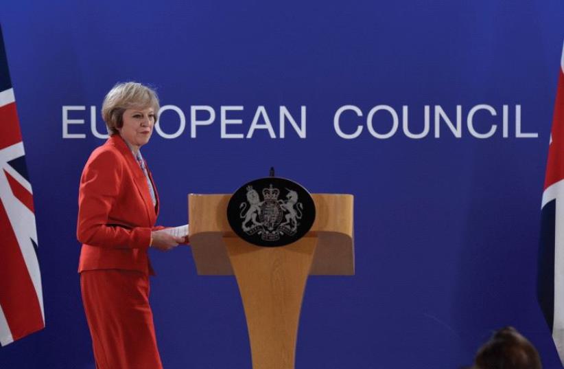 UK PRIME MINISTER Theresa May holds a news conference after the EU summit in Brussels on October 21. (photo credit: REUTERS)