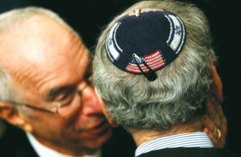 An American Jew wearing a kippa embroidered with the US and Israeli flags attends a Hanukka reception at the White House last year (photo credit: REUTERS)