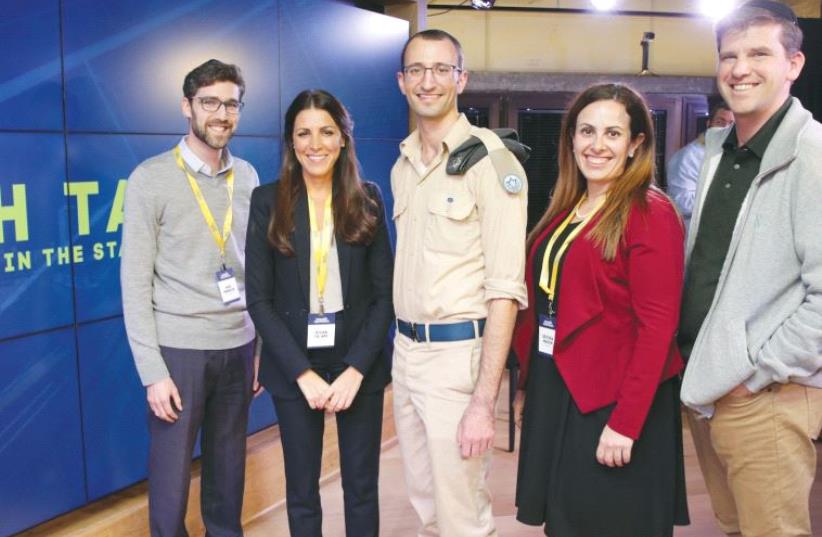 NEFESH B’NEFESH Tech Talk participants pose at last night’s event in Tel Aviv. From left: Moe Mernick, Silvan Ya’ari, Ilan Regenbaum, Devorah Mason, and Michael Eisenberg. (photo credit: YONIT SCHILLER)