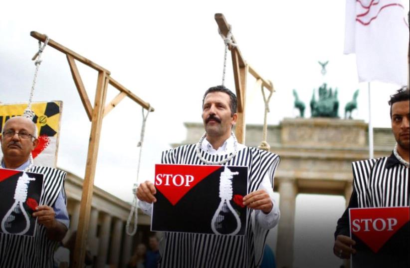 People stage a protest against the execution by Iran of up to 20 Kurds (photo credit: REUTERS)