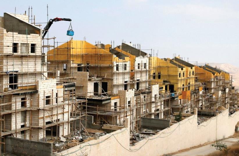 BULIDINGS ARE SEEN under construction in the settlement of Ma'aleh Adumim [File] (photo credit: REUTERS)