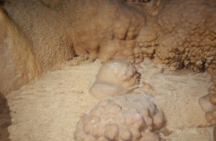 Rare stalactite, stalagmite cave discovered near Galilee (photo credit: SHAI KOREN/NPA)