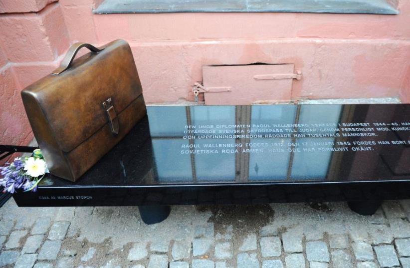 THE MEMORIAL BENCH commemorating Raoul Wallenberg is seen at its inauguration outside the Foreign Ministry in Stockholm in 2012, about two weeks after the centennial of his birth. (photo credit: REUTERS)