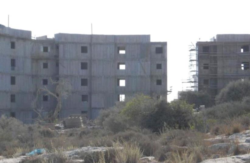 In Beit Shemesh, overlooking the valley from the northeast, construction of 14,000 planned housing units is now in full swing (photo credit: EVE FINKELSTEIN)