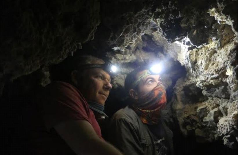 Archaeologists Oren Gutfeld and Ahiad Ovadia survey the cave (photo credit: COURTESY OF CASEY L. OLSON AND OREN GUTFELD)