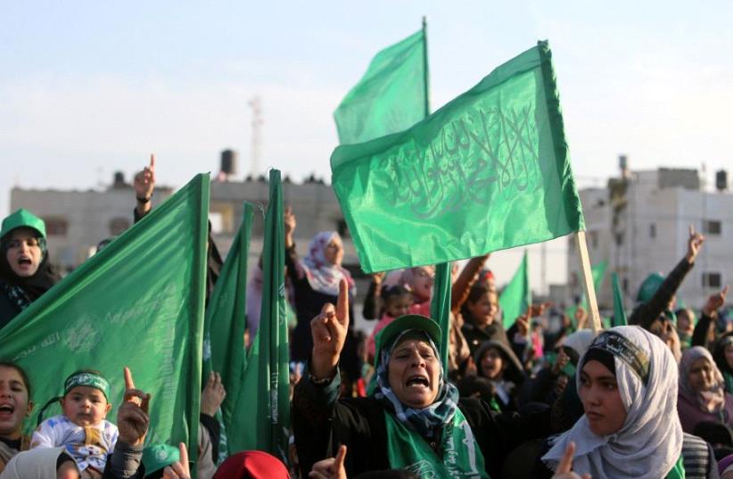 Palestinians take part in a rally marking the 29th anniversary of the founding of the Hamas movement, in Rafah in the southern Gaza Strip December 16, 2016 (photo credit: REUTERS)