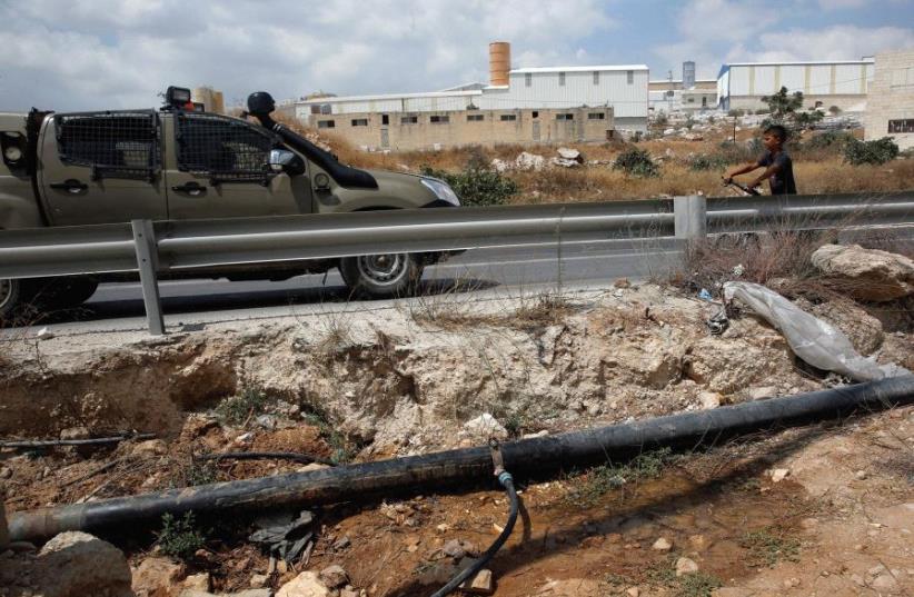 Where is this pipe leading? A water pipe near Hebron last year (photo credit: REUTERS)