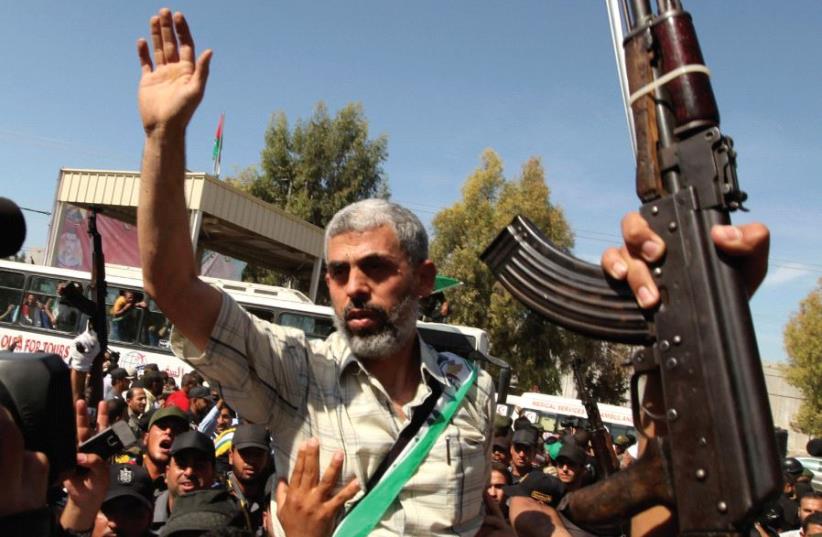 Yahya Sinwar arrives at the Rafah crossing between Egypt and Gaza on October 18, 2011, after being released by Israel as part of a prisoner swap for kidnapped soldier Gilad Schalit (photo credit: REUTERS)