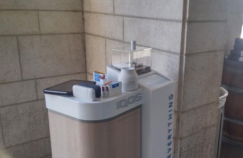 A Philip Morris stand promoting the tobacco company’s iQOS electronic cigarette product is seen on Jerusalem’s Kanfei Nesharim Street on March 20, 2017 (photo credit: JUDY SIEGEL-ITZKOVICH)