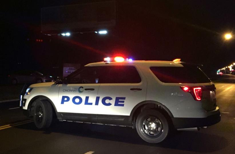 A police car blocks access to the scene of a mass shooting at the Cameo Nightlife club in Cincinatti, Ohio, US March 26, 2017. (photo credit: REUTERS)