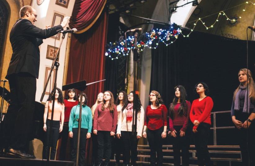 Micah Hendler directs the YMCA Jerusalem Youth Chorus (photo credit: OR DOGAN)