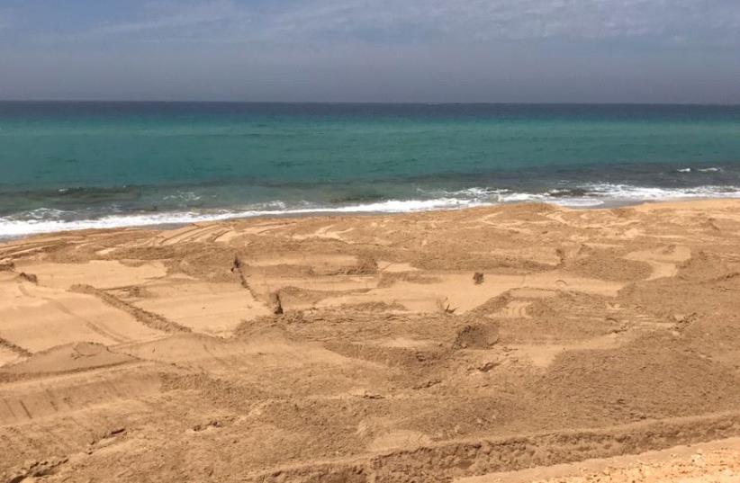 A section of the Nahariya beach following cleanup. (photo credit: YORAM VARGA)