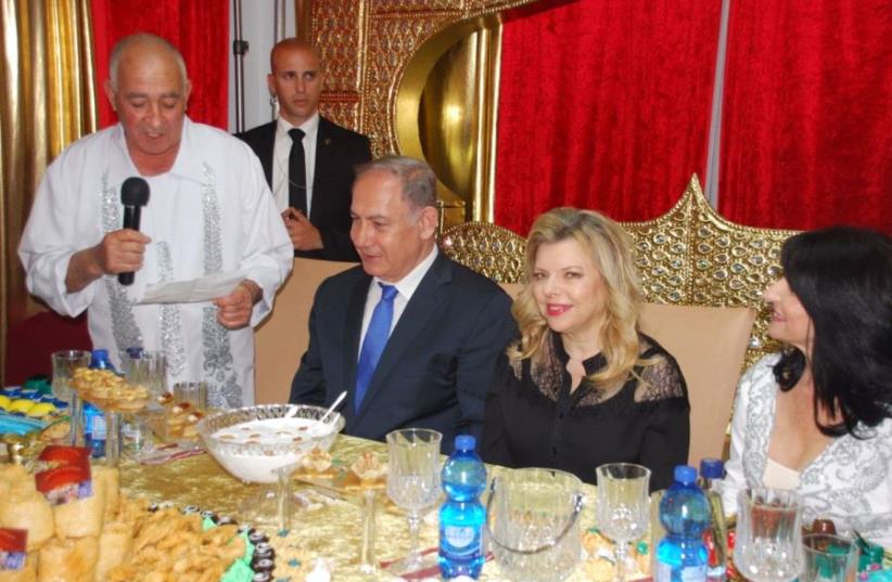 Prime Minister Benjamen Netanyahu and his wife Sarah celebrate the Mimouna in Hadera (photo credit: GPO)