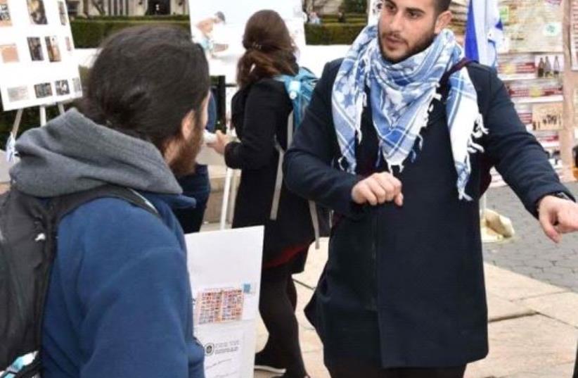 Rudy Rochman talking to students at Columbia University during an event organized in response to Israel Apartheid week (photo credit: STUDENTS SUPPORTING ISRAEL)