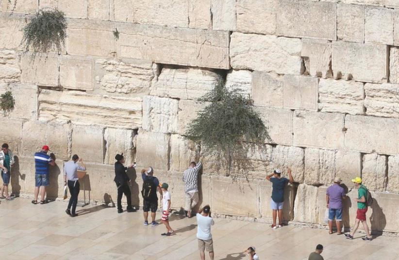 People at the Western Wall in Jerusalem (photo credit: MARC ISRAEL SELLEM)