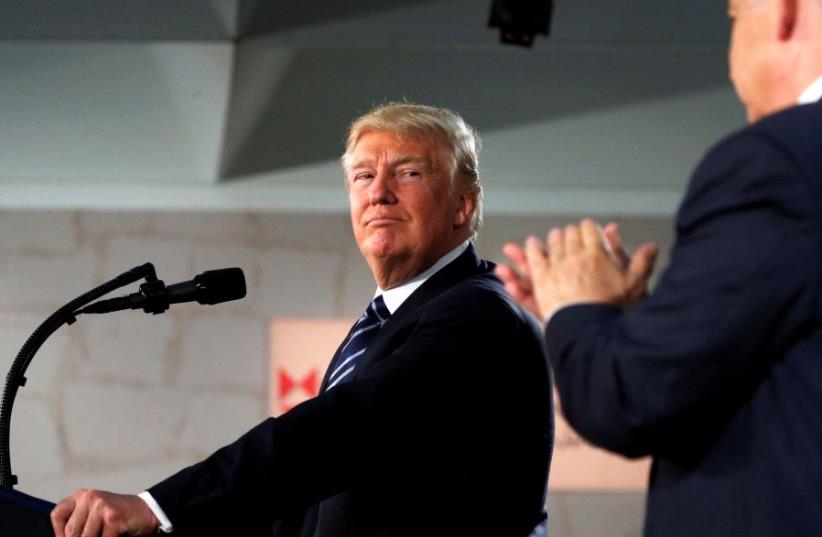 U.S. President Donald Trump looks towards Israeli Prime Minister Benjamin Netanyahu while delivering an address at the Israel Museum in Jerusalem May 23, 2017.  (photo credit: JONATHAN ERNST / REUTERS)