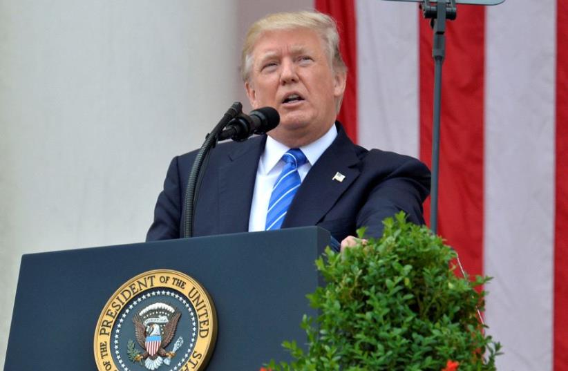 U.S. President Donald Trump makes remarks at the Amphitheater after laying a wreath at the Tomb of the Unknown Soldier at Arlington National Cemetery as part of Memorial Day observance, Arlington, Virginia, U.S., May 29, 2017 (photo credit: REUTERS)