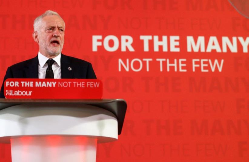 Jeremy Corbyn, the leader of Britain's opposition Labour party, makes a speech as his party restarts its election campaign after the cross party suspension that followed the Manchester Arena attack, in London, May 26, 2017. (photo credit: REUTERS/PETER NICHOLLS)