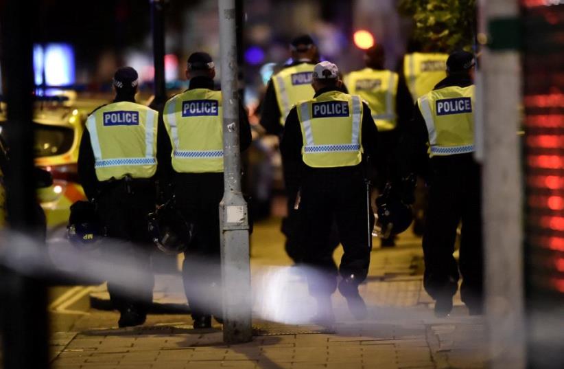 Police attend to an incident on London Bridge in London, Britain, June 3, 2017 (photo credit: REUTERS / HANNAH MCKAY)