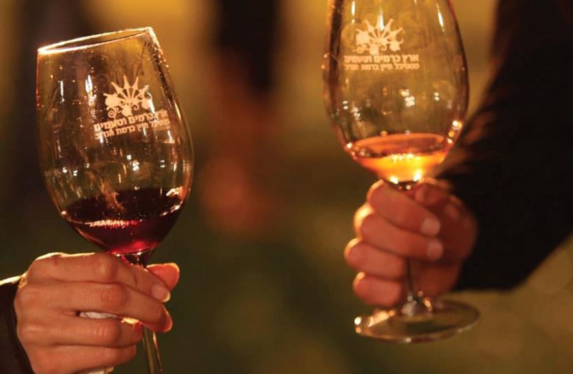 People hold wine glasses (photo credit: PR)