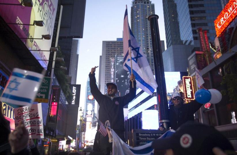 Pro-Israel demonstrators chant slogans in New York City in 2015. One segment of American Jewry that has drawn closer to Israel these past 50 years is the 10% who are Orthodox (photo credit: REUTERS)