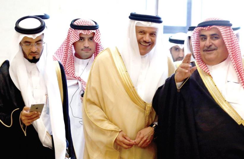 Secretary-General of the Gulf Cooperation Council Abdullatif bin Rashid Al Zayani and Bahrain’s Foreign Minister Khalid bin Ahmed Al Khalifa walk during a meeting of foreign ministers of GCC member states, in Riyadh, Saudi Arabia, in March (photo credit: REUTERS)