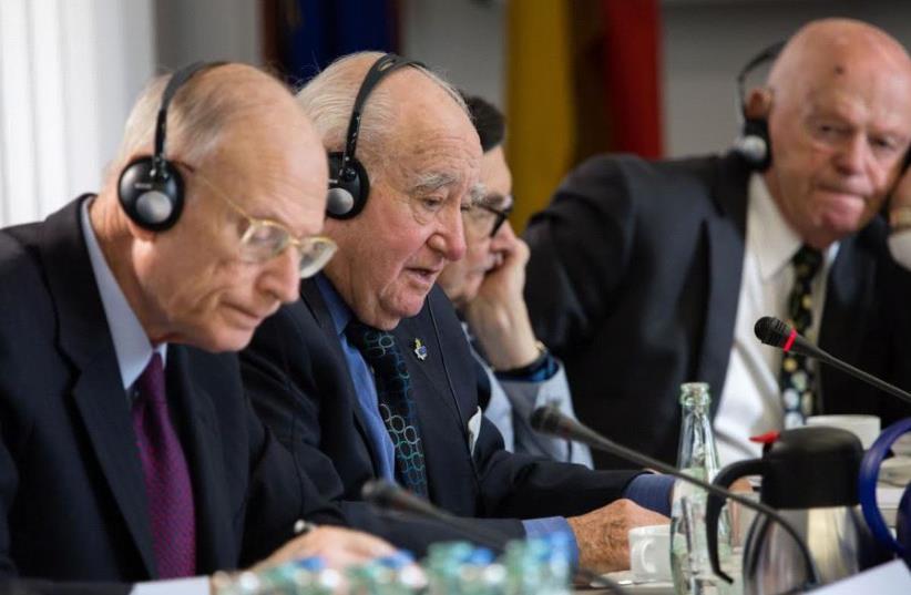 Ambassador Eizenstat is the closest to camera Next to him are Auschwitz survivor, Roman Kent and Marian Turski last is Ben Helfgott, survivor of Buchenwald (photo credit: MARCO LIMBERG)