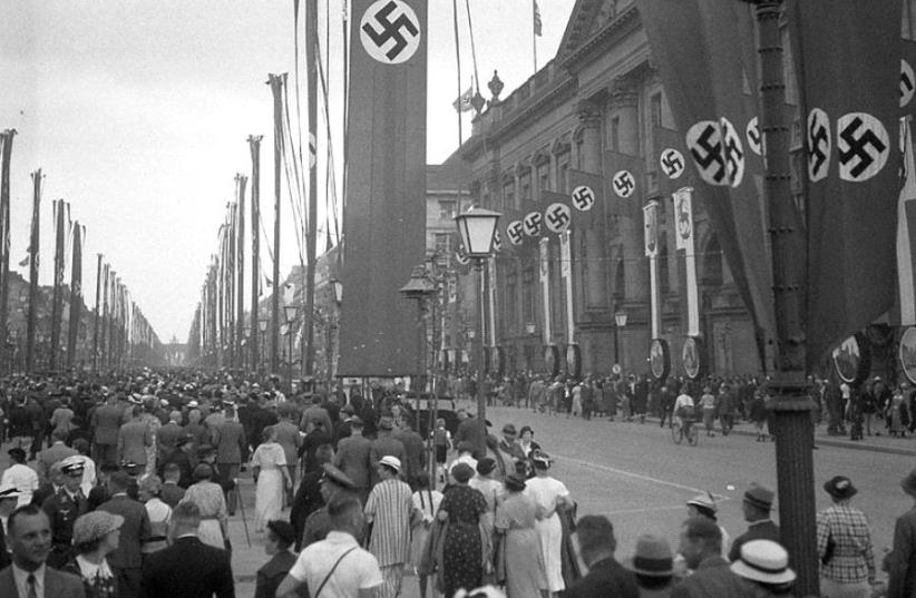 The Nazi regime organized the mass displays of Nazi propaganda and nationalist symbols across Germany during the 1936 Berlin Summer Olympics events (photo credit: FOTO:FORTEPAN / LŐRINCZE JUDIT VIA CC BY-SA 3.0)