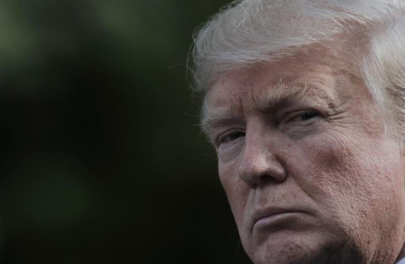 US President Donald Trump looks on during a news conference in the Rose Garden of the White House in Washington, US, June 26, 2017. (photo credit: REUTERS)