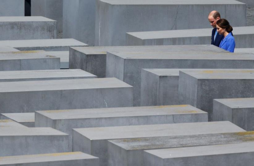 Prince William, the Duke of Cambridge and his wife Catherine, The Duchess of Cambridge, visit the Holocaust Memorial in Berlin, Germany July 19, 2017 (photo credit: HANNIBAL HANSCHKE/REUTERS)