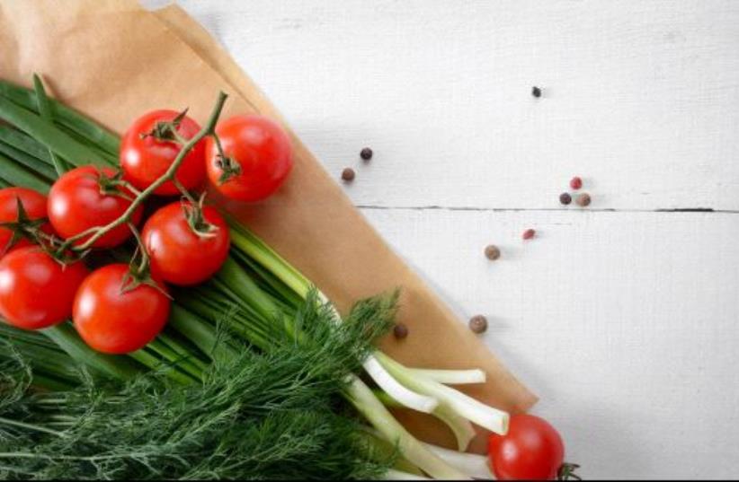 Fresh organic vegetable set of tomatoes dill and onion on white kitchen table (photo credit: INGIMAGE)