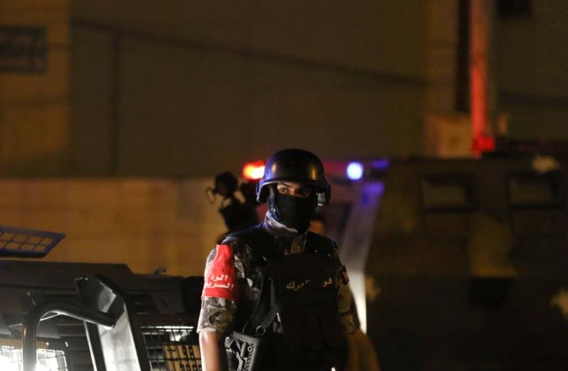 A policeman is seen near the Israeli embassy in Amman, Jordan July 23, 2017. (photo credit: REUTERS)