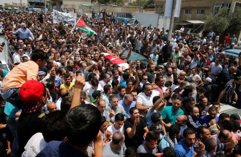 People attend the funeral of Mohammad Jawawdah in Amman, Jordan July 25, 2017.  (photo credit: REUTERS)