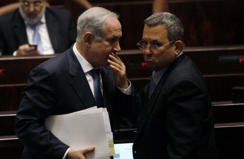 Israel's Prime Minister Benjamin Netanyahu (L) speaks with Ehud Barak at the Knesset, the Israeli parliament, in Jerusalem June 8, 2009. (photo credit: REUTERS)