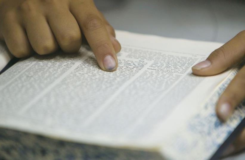 The practice of ‘Tikkun Leil Shavuot’ is to dedicate one whole night to the study of Torah and discussion (photo credit: REUTERS)