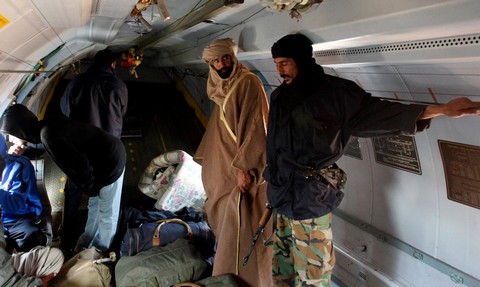 Saif al-Islam Gaddafi is seen standing in a plane