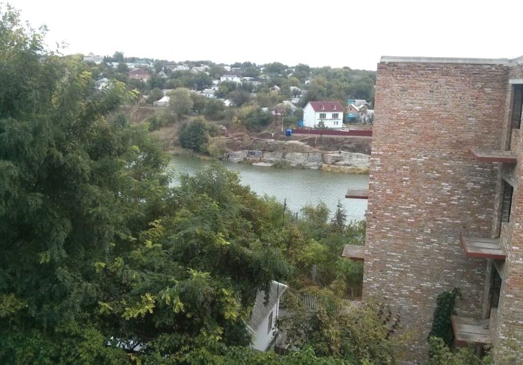 Apartments tower over one of the small lakes used for Tashlich services on Rosh Hashana in Uman (photo credit: CHAIM GREENBERG)