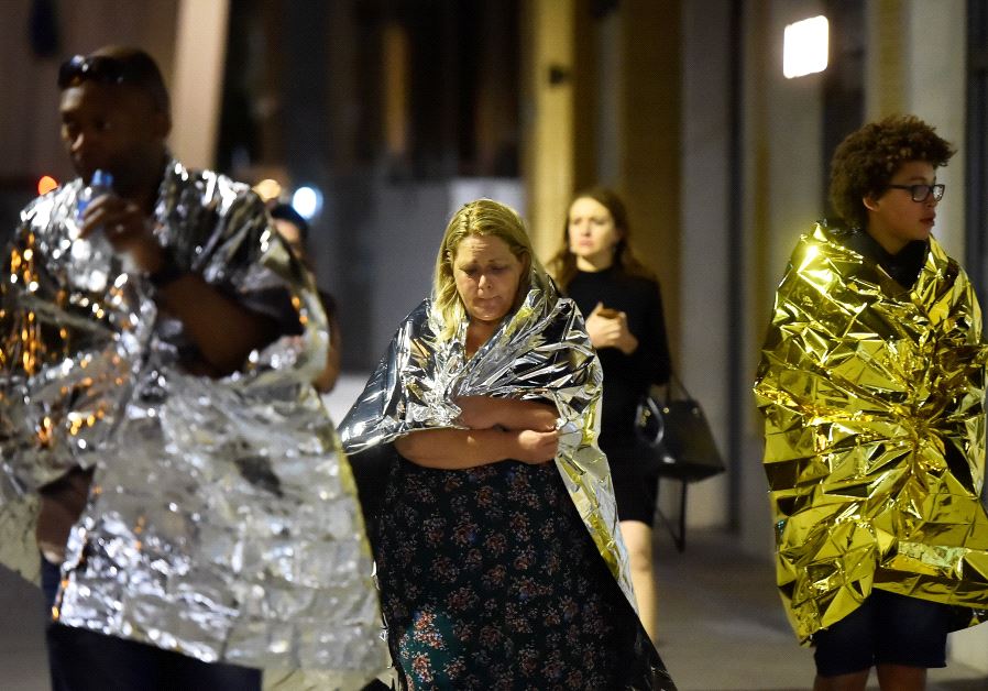 People flee as police attend to the scene of the London Bridge attack (credit: REUTERS/Hannah McKay)