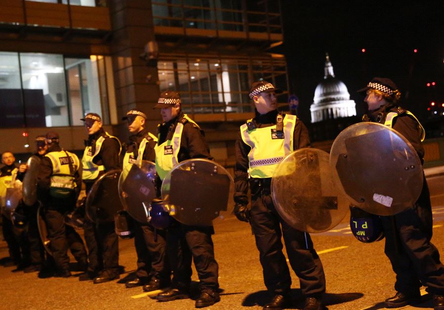 Police officers guard the approach to Southwark Bridge after an attack near London Bridge in London. (Reuters/Neil Hall)