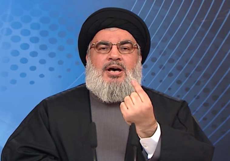 Hassan Nasrallah (credit: HO / AL-MANAR TV / AFP)