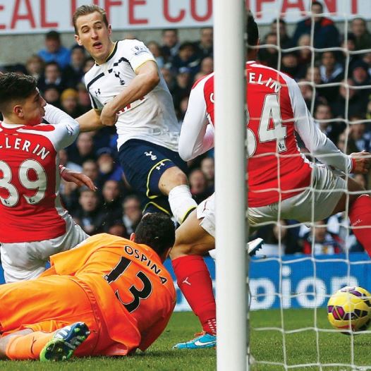 Harry Kane of Tottenham Hotspur scores against Arsenal during their English Premier League soccer match at White Hart Lane, London, in February (credit: EDDIE KEOGH / REUTERS)