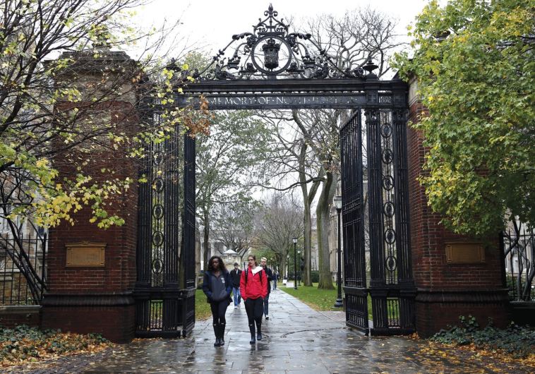 STUDENTS WALK on the campus of a university in Connecticut (credit: REUTERS)