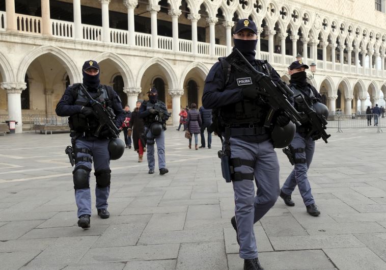 Italian police officers [File] (credit: REUTERS)