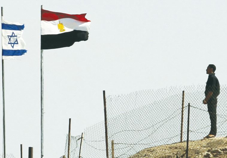 EGYPTIAN AND ISRAELI flags flutter next to each other at the Taba border crossing. (credit: REUTERS)