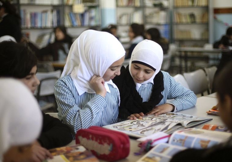 Palestinian students (credit: MOHAMAD TOROKMAN/REUTERS)
