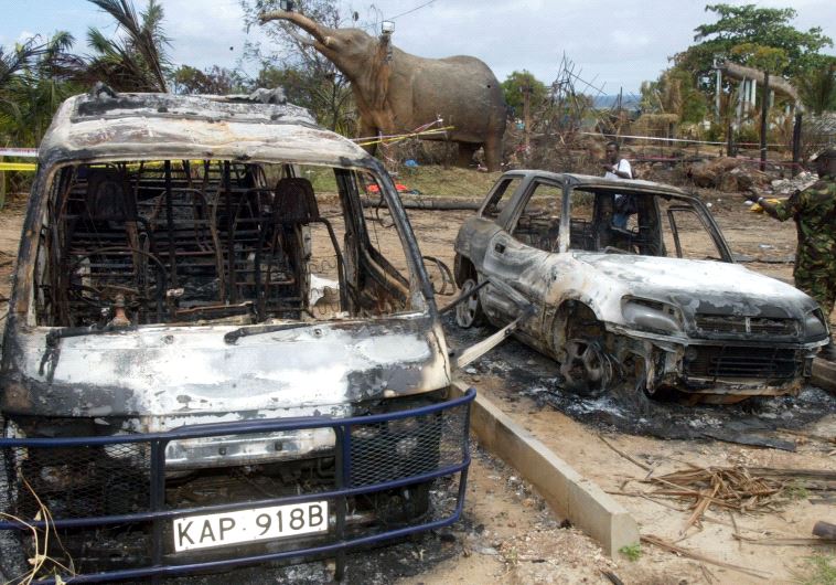    BURNED CARS ARE SEEN IN THE GROUNDS OF THE PARADISE HOTEL IN MOMBASA. (credit: REUTERS)