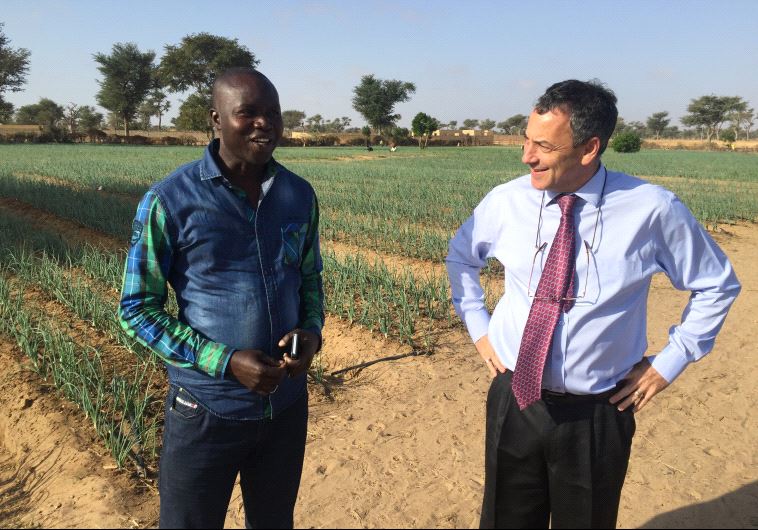 Ambassador Paul Hirschson at a small farm project supported by Israel in Senegal in March  (credit: SETH J. FRANTZMAN)