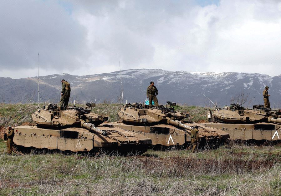 IDF tanks are seen along the Golan Heights border with Syria. (credit: REUTERS)